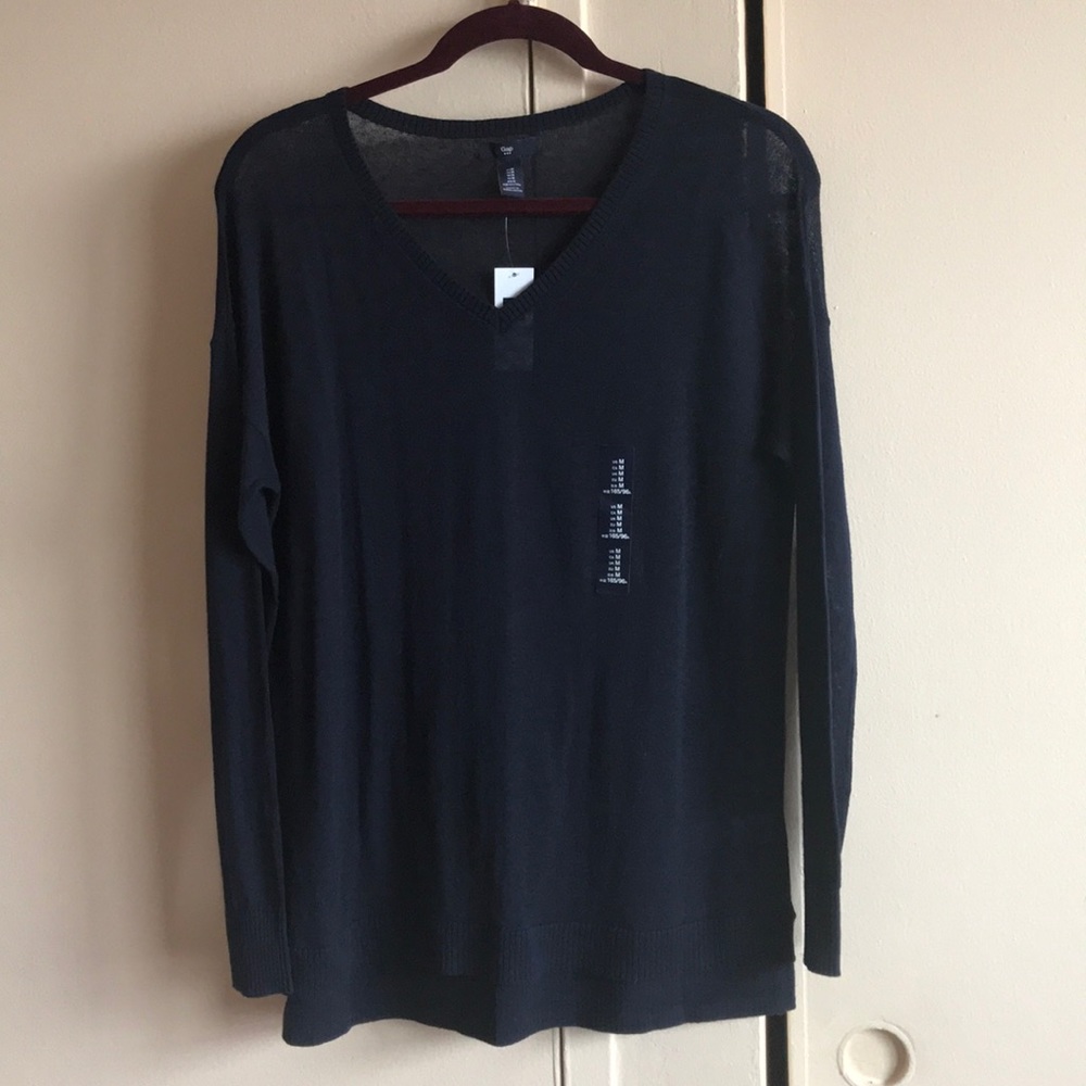 A dark blue sweater from gap NWT size Large